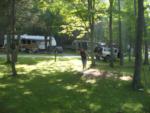 Parked RV at site Country Charm Campground - thumbnail