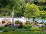 The river beyond beautiful landscaping - thumbnail