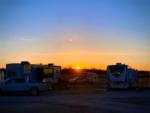 RVs in sites at sunset - thumbnail