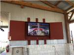 The enclosed hanging television at IRON HORSE RV RESORT - thumbnail