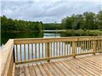 A wooden deck on the water at MIDPOINT I-95 RV PARK - thumbnail