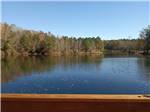 A view of the water surrounded by trees at Midpoint I-95 RV Park - thumbnail