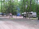 RV and tent in a treed site - thumbnail