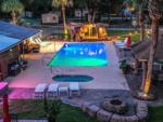 The pool area at night at VACAY VILLAGE OF PENSACOLA - thumbnail