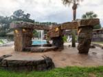 A Stonehenge replica water feature at VACAY VILLAGE OF PENSACOLA - thumbnail