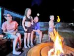 Family roasting marshmallows in the fire pit at VACAY VILLAGE OF PENSACOLA - thumbnail