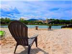 Chairs in the sand by the lake at MAMMOTH RIDGE RV PARK - thumbnail