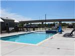 Pool area with bridge in background at Medical Center RV Resort - thumbnail