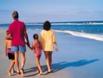 A family walking on the beach - thumbnail