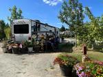 RV site with plants and flowers at North Haven Campground - thumbnail