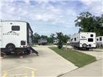 Paved sites flanked with grass at Gator RV Park - thumbnail