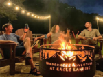 People around a firepit at Wilderness Adventure at Eagle Landing - thumbnail