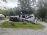 A trailer parked in a camping site at PIPESTEM RV PARK AND CAMPGROUND - thumbnail