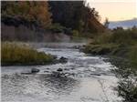 River running through a valley at sunset - thumbnail