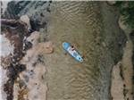 Aerial view of a lady on a paddle board at CAMP COLD SPRINGS - thumbnail