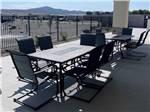 Tables and chairs in a sitting area at WHISTLESTOP LUXURY RV PARK - thumbnail