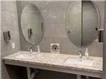 A view of the sinks in the bathroom at WHISTLESTOP LUXURY RV PARK - thumbnail