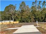 One of the empty paved sites at THE STATION RV RESORT - thumbnail