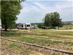 RVs parked in gravel sites at CORINTH RV PARK - thumbnail