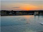 The swimming pool at sunset at FIREFLY LUXURY RV RESORT - thumbnail