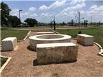 A large cement fire pit at SCHATZILAND RV RESORT - thumbnail