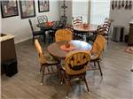 The dining area with chairs covered with pumpkin faces at ELM ACRES RV RESORT - thumbnail
