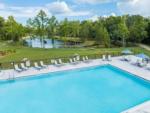 A view of the pool area and pond at SWEET CITRUS ACRES RV RESORT - thumbnail