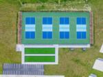 Aerial view of bocce ball and pickle ball courts at SWEET CITRUS ACRES RV RESORT - thumbnail