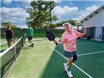 A lady just finished playing pickleball at CANOPY LUXURY RV RESORT - thumbnail