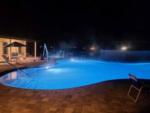 The swimming pool lit up at night at STRAWBERRY FIELDS FOR RV'ERS - thumbnail