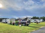 A row of trailers parked on grassy sites at STRAWBERRY FIELDS FOR RV'ERS - thumbnail