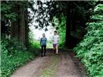 A couple walking on a nature trail at ANGEL OF THE WINDS RV RESORT - thumbnail