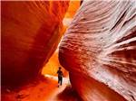 A lady in the Peek A Boo Slot Canyon nearby at SETTLERS JUNCTION RV PARK - thumbnail