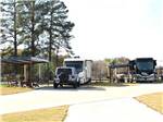 Two motorhomes parked in concrete sites at GOD'S COUNTRY RESORT - thumbnail