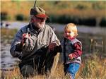 A grandpa and grandson fishing at FALL CREEK MARINA AND CAMPGROUND - thumbnail