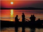 A group fishing at dusk at FALL CREEK MARINA AND CAMPGROUND - thumbnail