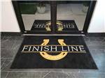 A mat with the park name on it at FINISH LINE RV PARK - thumbnail