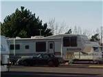A fifth wheel parked on-site at TRI-CITIES RV PARK - thumbnail