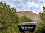 A sign showing the Lime Liln Canyon Climbing Area nearby at MESQUITE TRAILS RV RESORT - thumbnail