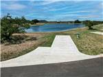 A paved site next to the lake at SKYE TEXAS HILL COUNTRY RESORT - thumbnail