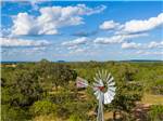 A windmill next to a lot of trees at SKYE TEXAS HILL COUNTRY RESORT - thumbnail