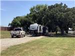 A fifth wheel trailer parked in a back in site at OLD TOWNE RV RANCH - thumbnail