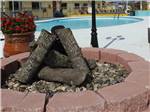 A fire pit near the pool at RIO VALLEY ESTATES 55+ MOBILE/RV PARK - thumbnail