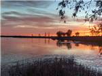 The sunset reflecting on the lake at LUCKY LAKE 208 - thumbnail