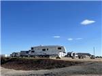 Travel trailers parked in gravel sites at LUCKY LAKE 208 - thumbnail