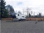 A fifth wheel parked at FAR WEST RV PARK - thumbnail