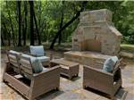 Chairs around a large fire pit at SUNDOWNER RV PARK - thumbnail