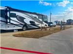 Class A motorhome parked in a RV site at THE RV RESORT - thumbnail