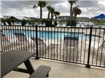 Pool side loungers at Grand Riviera RV Resort - thumbnail