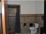 The shower stall and toilet at WHISPERING RIVER RANCH RV PARK - thumbnail
